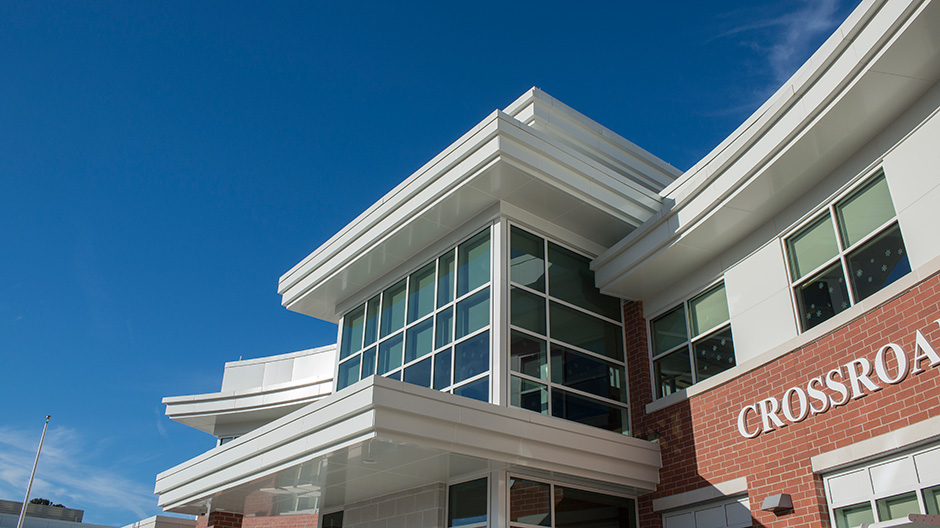 Closeup of white ALPOLIC MCM cladding school