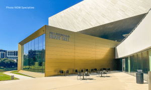 Closeup of Brady Hall clad with custom Gold ALPOLIC MCM