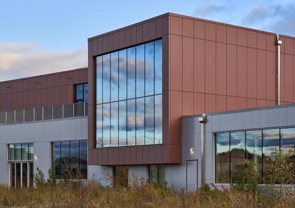 Closeup of Espace Citoyen building with Red Zinc ALPOLIC exterior panels (Confluents Citizens Space)